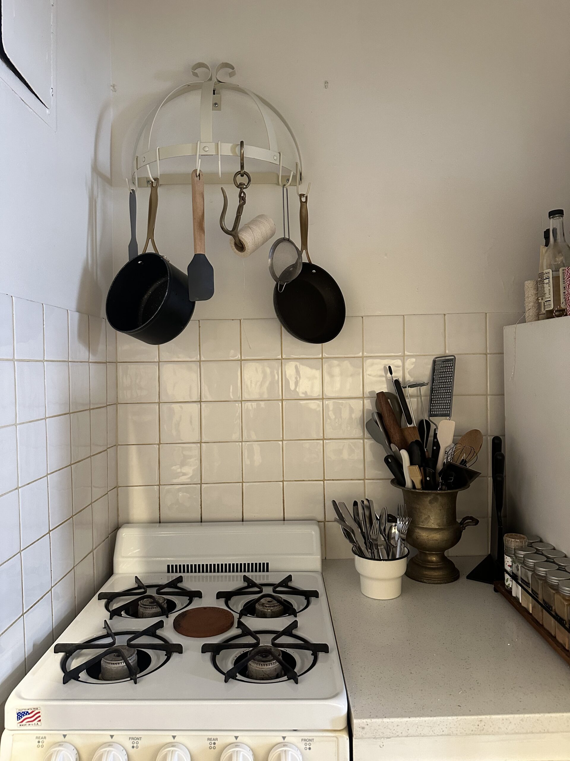 Add space to your kitchen by mounting a utensil rack above your stove, nyc handyman