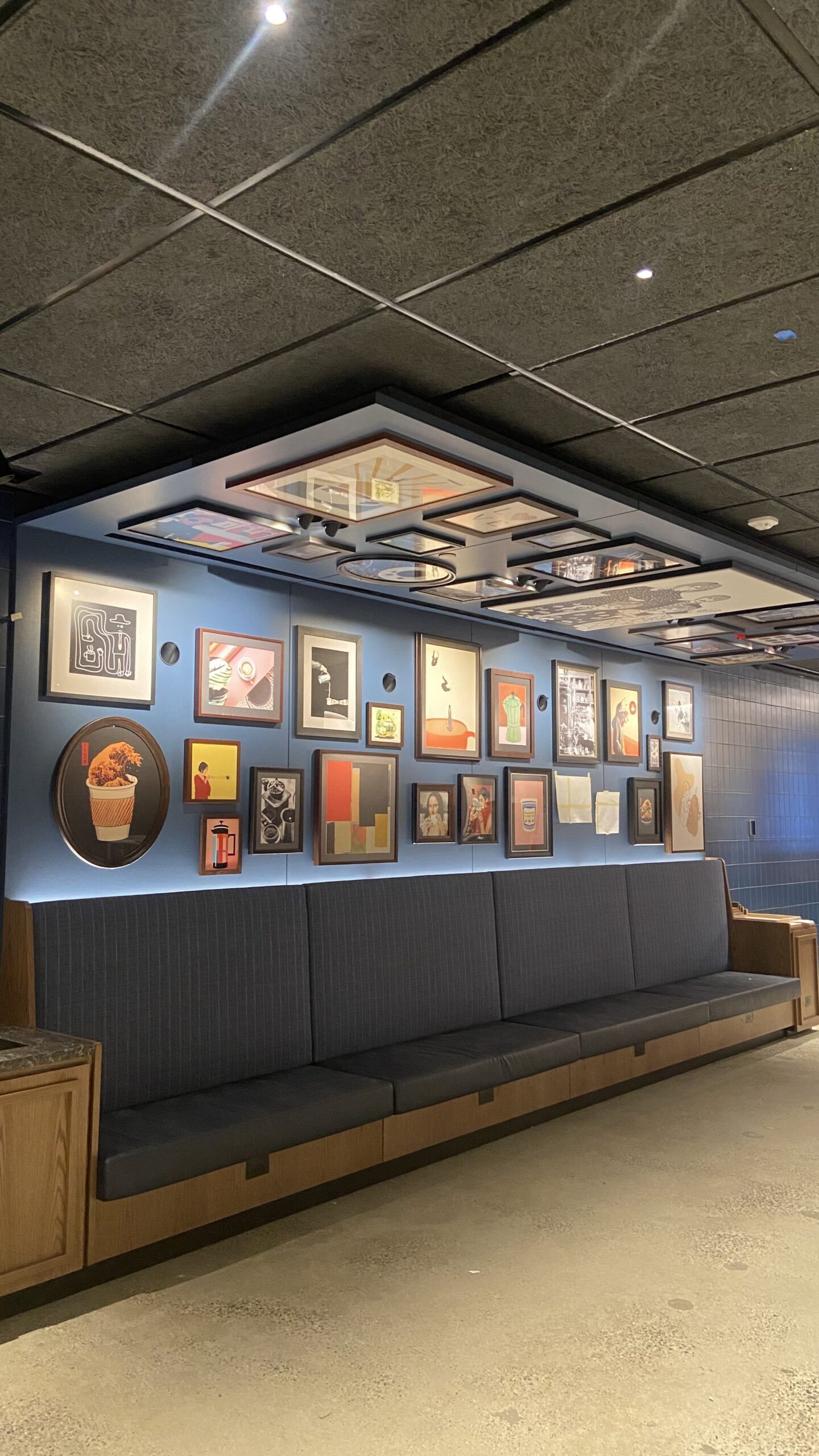 This image displays a collection of wall art successfully mounted in a pattern by a brooklyn based handyman