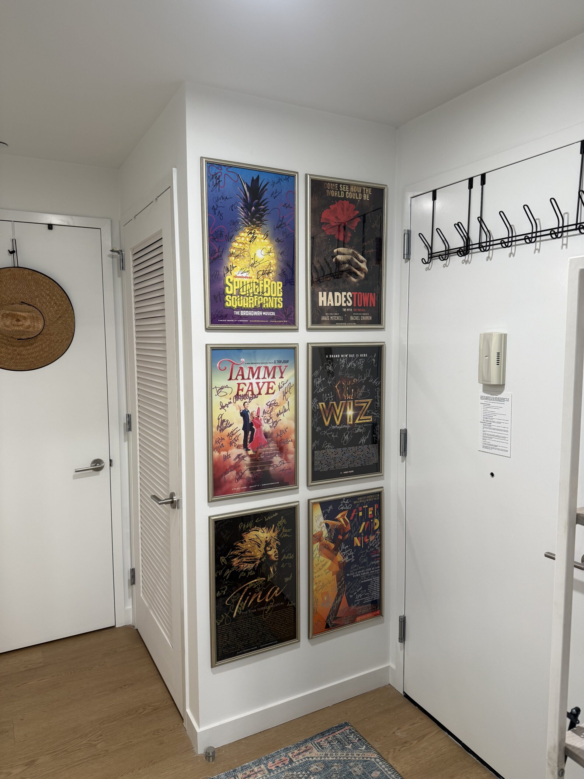Six Broadway show posters gallery wall installation NYC
