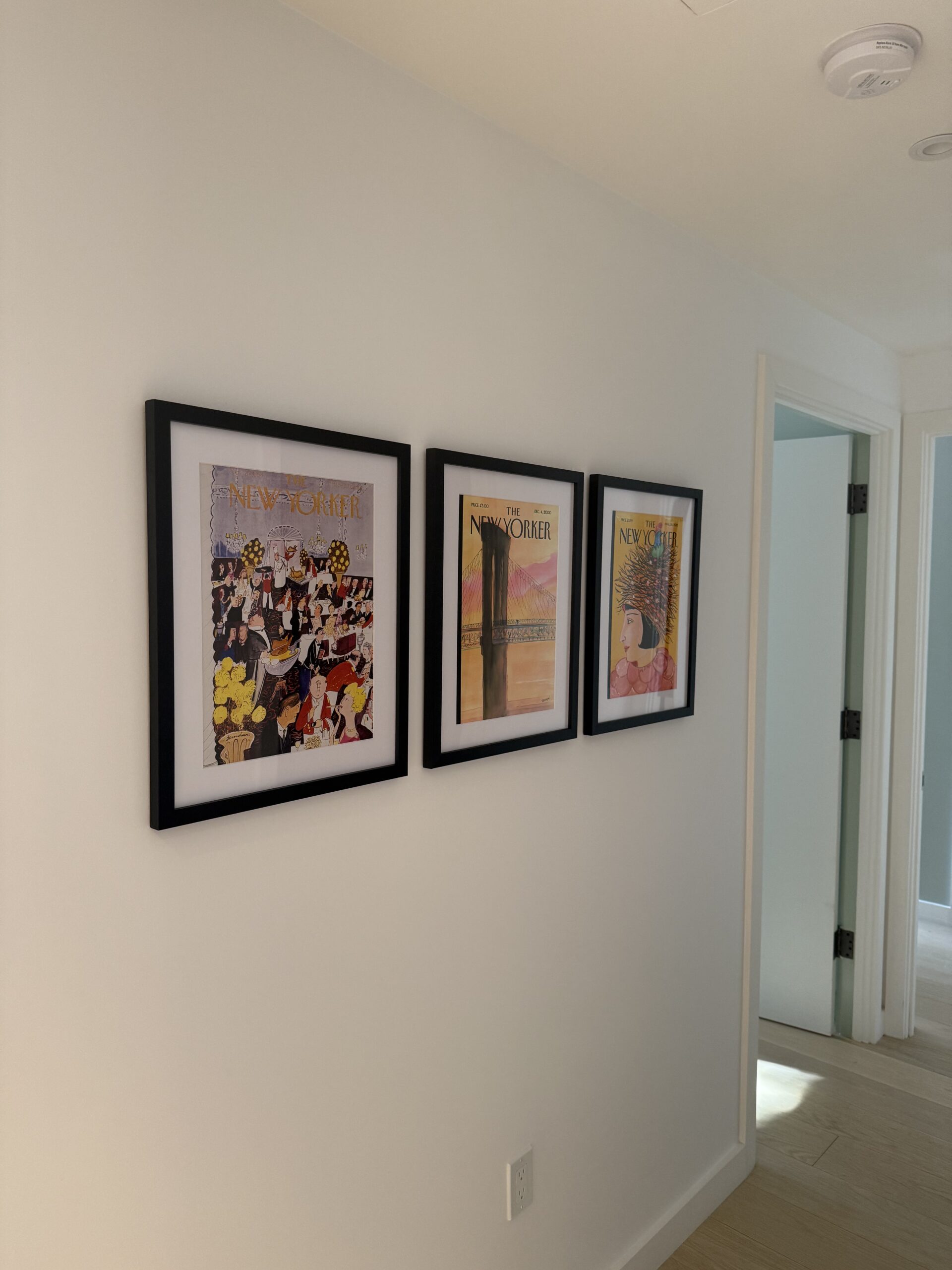 New Yorker magazine cover gallery wall in NYC home