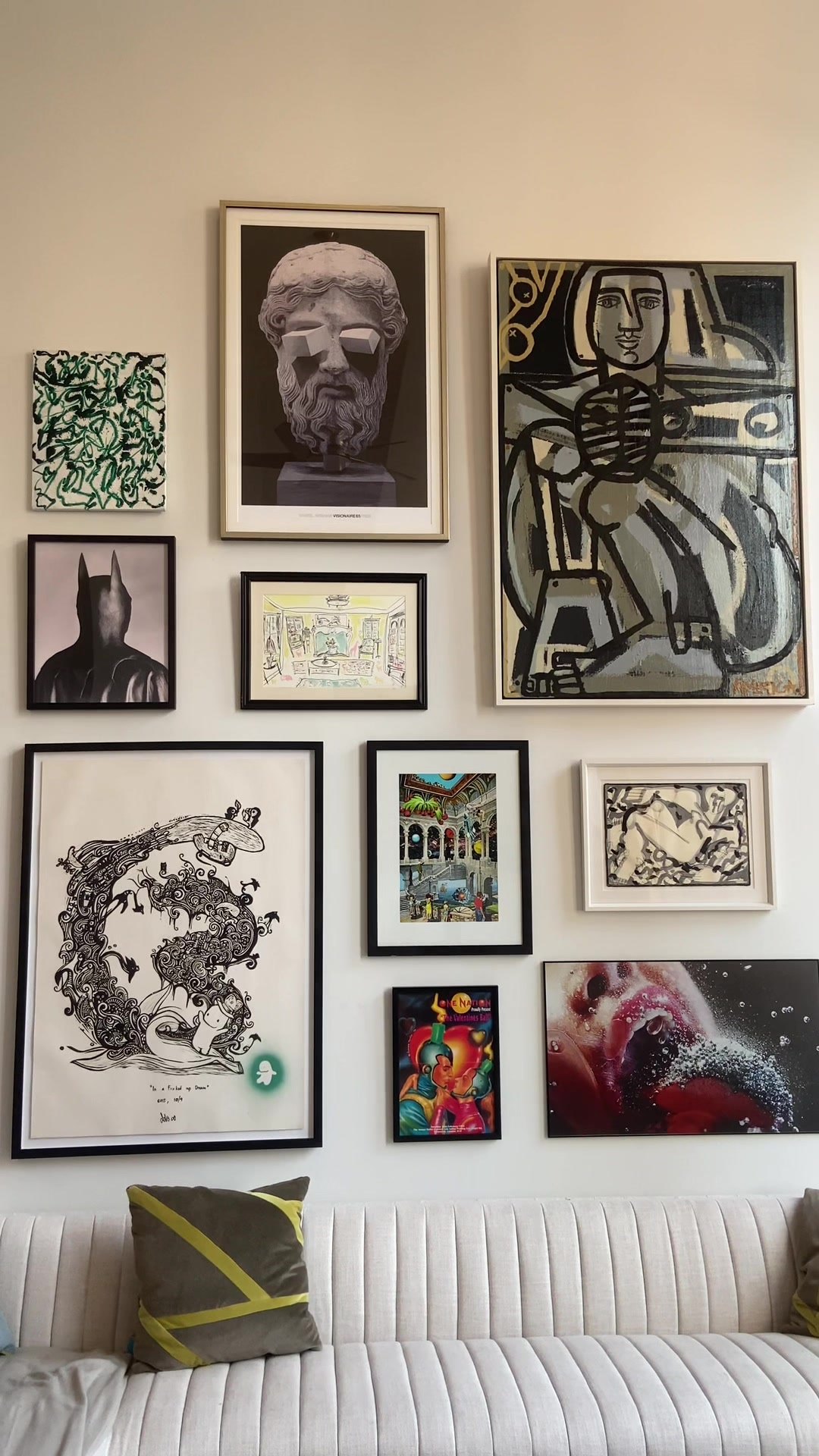 Completed salon-style gallery wall in a NYC apartment