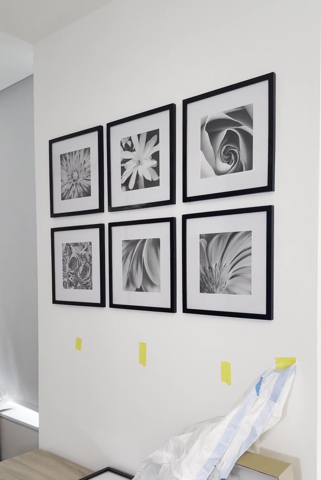 After: six black frames hung in a perfect grid