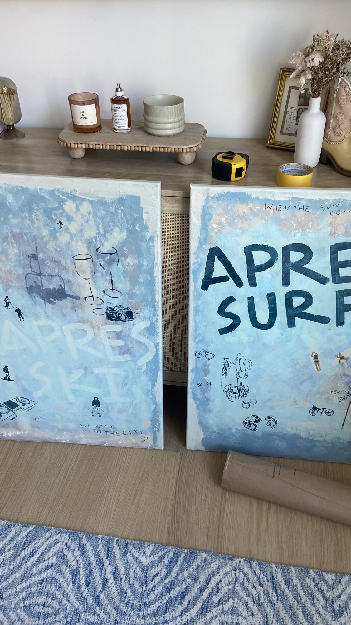 Before: two Apres Surf canvases leaning against the wall on the floor