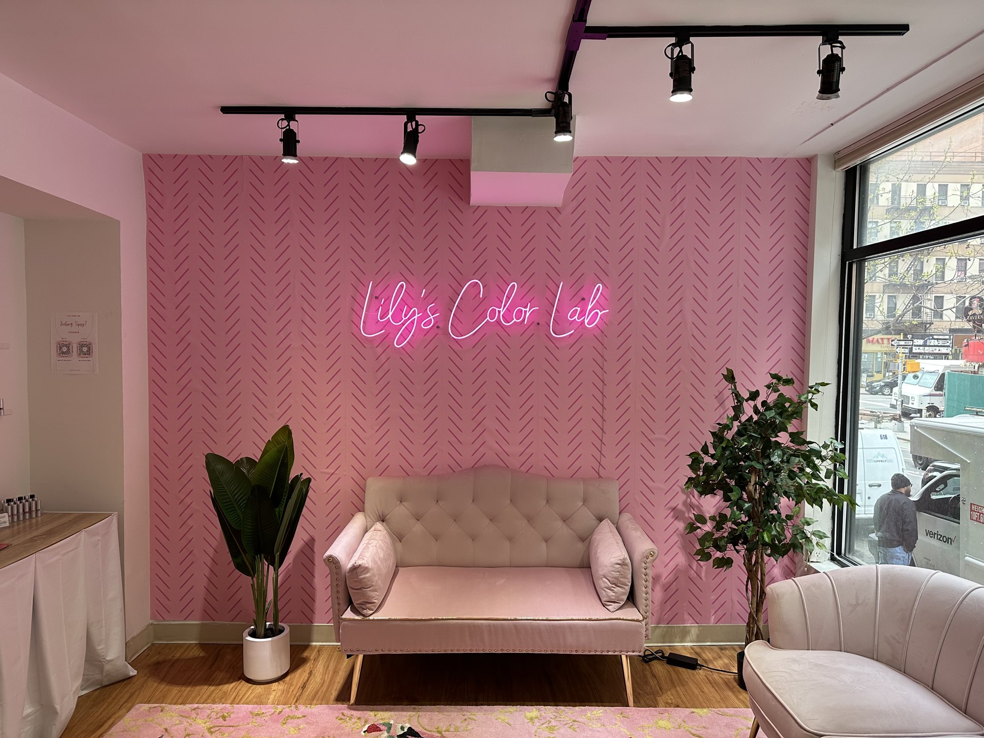 Neon sign and decor installed at a NYC hair salon