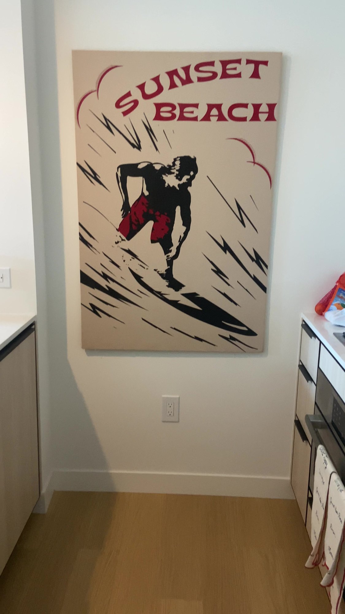 Sunset Beach canvas mounted in an apartment hallway