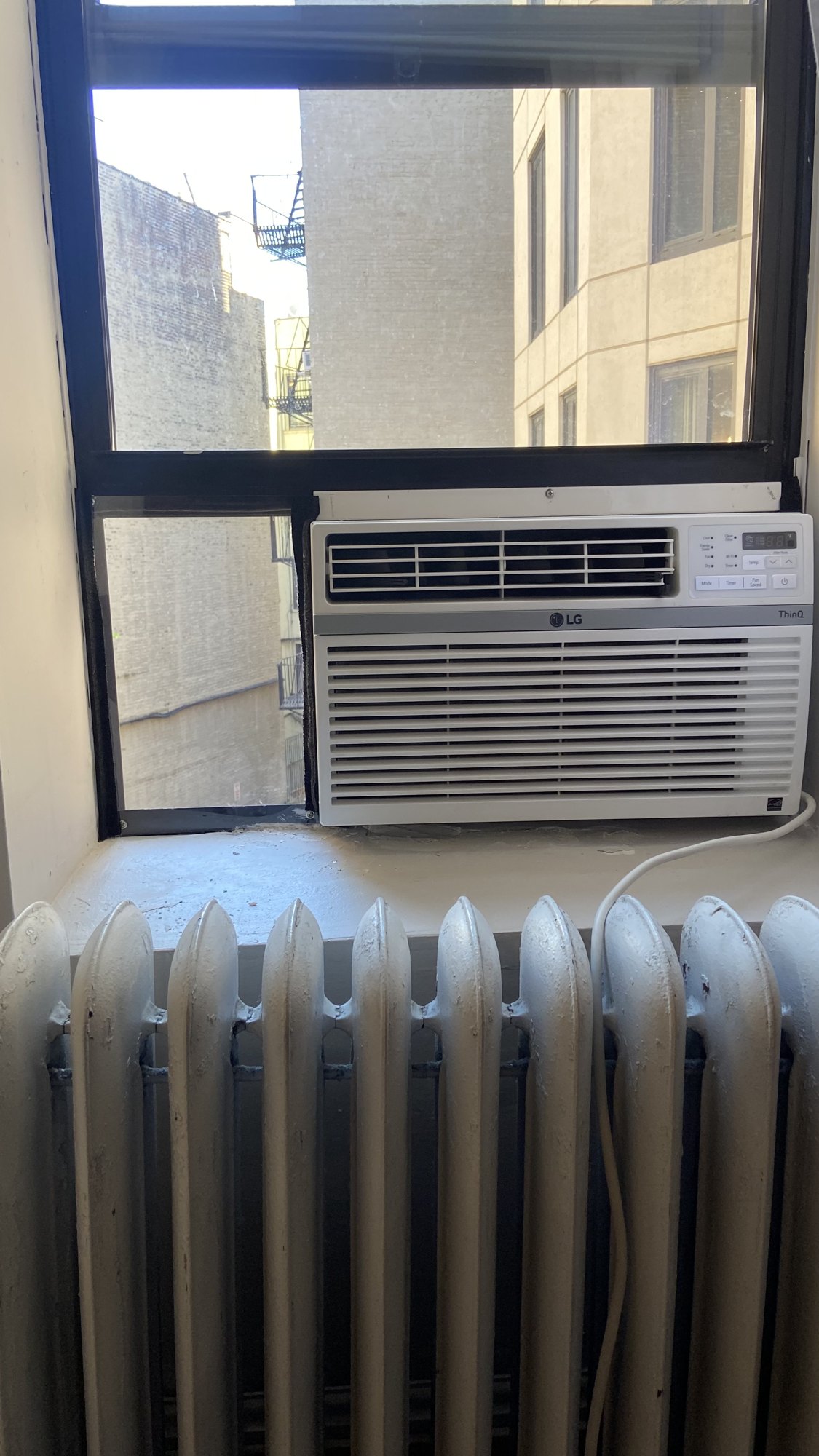Window air conditioner installed in a NYC apartment
